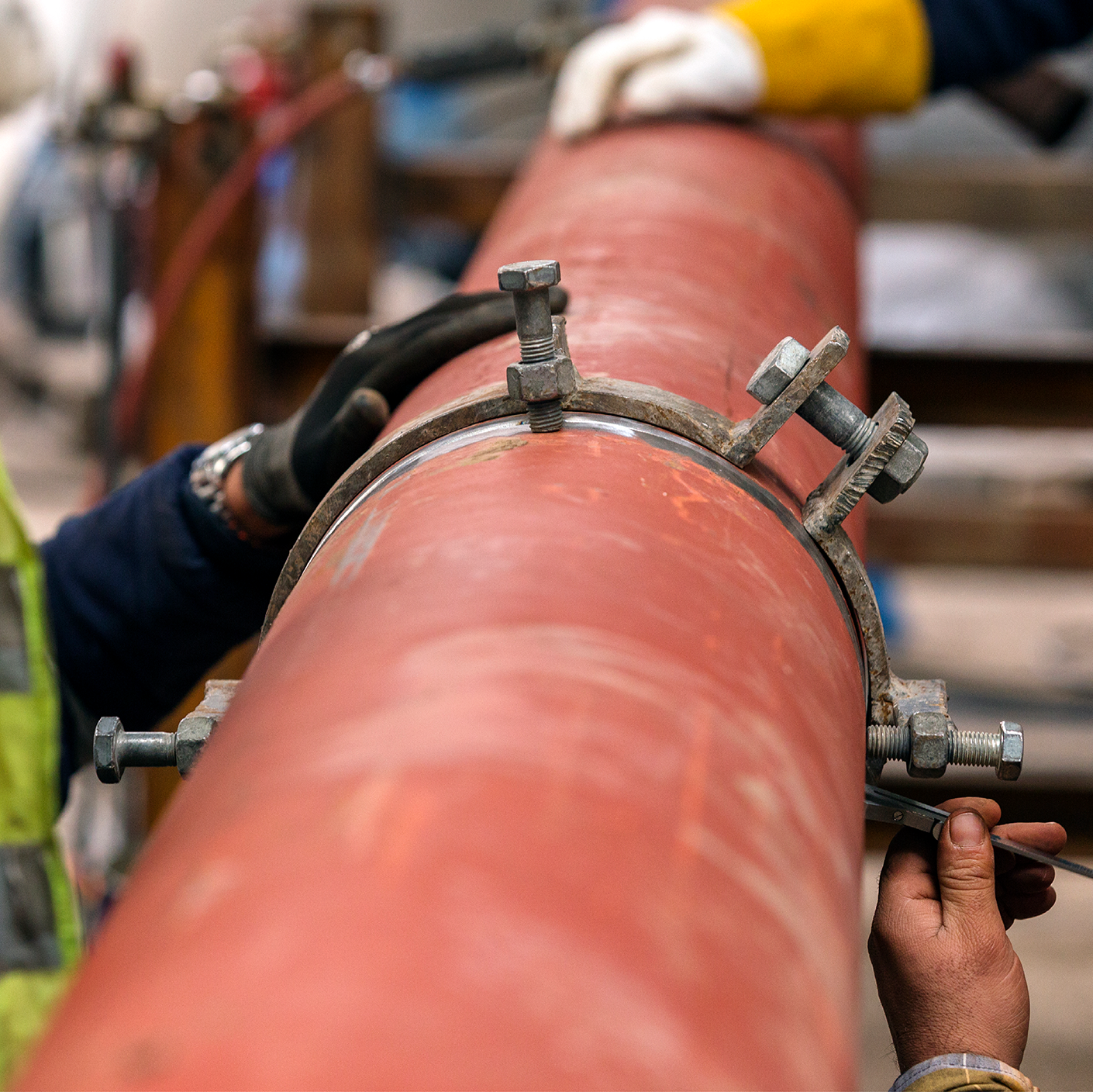 Crews working on a large-diameter natural gas pipe